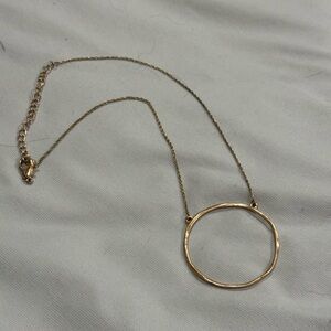 Gold necklace with big circle
